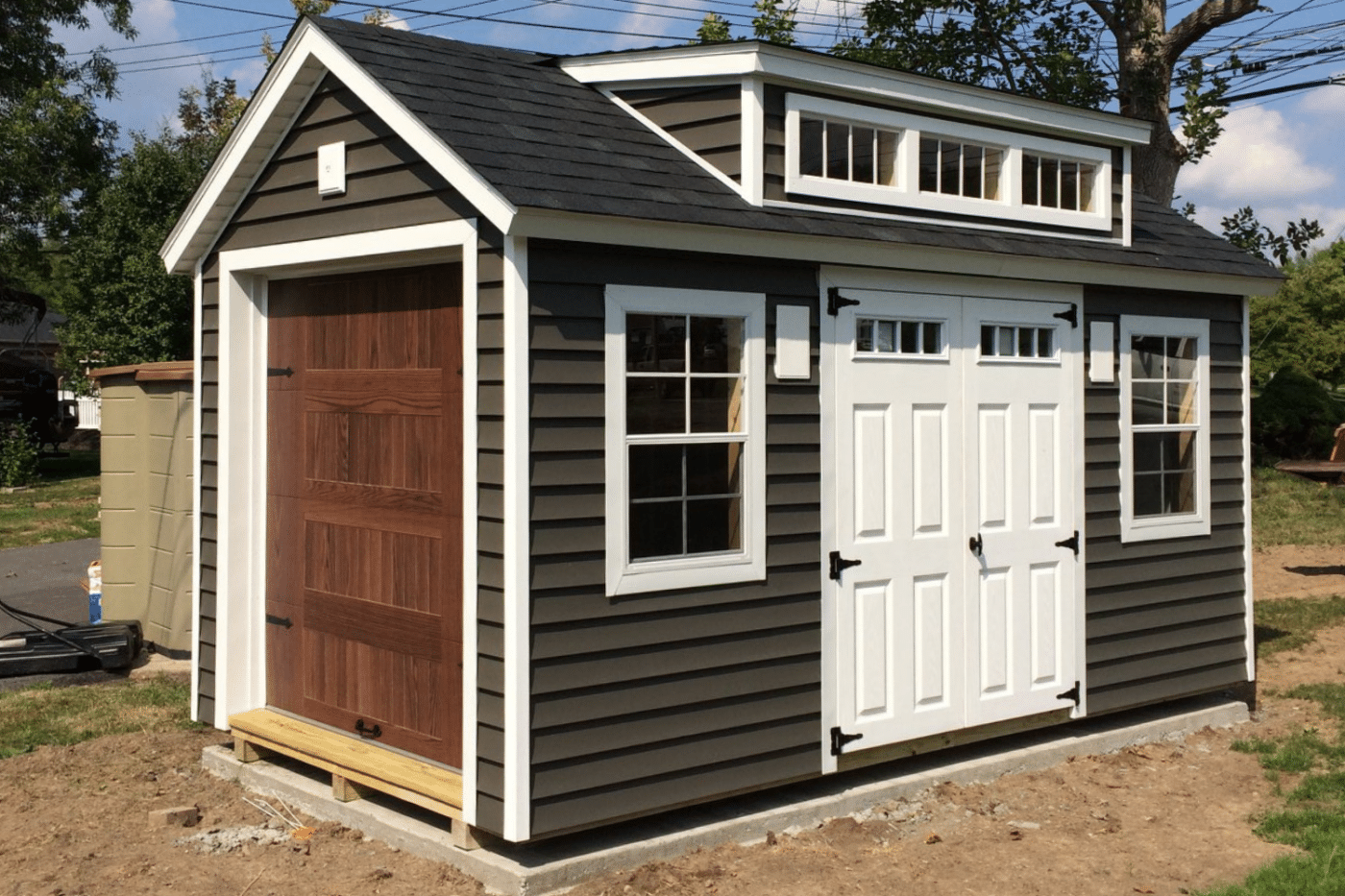 12x30 gray chalet garage with brown garage with double doors and windows in new york
